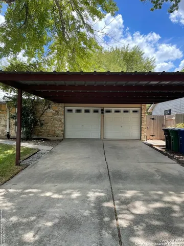 a view of outdoor space and a parking area