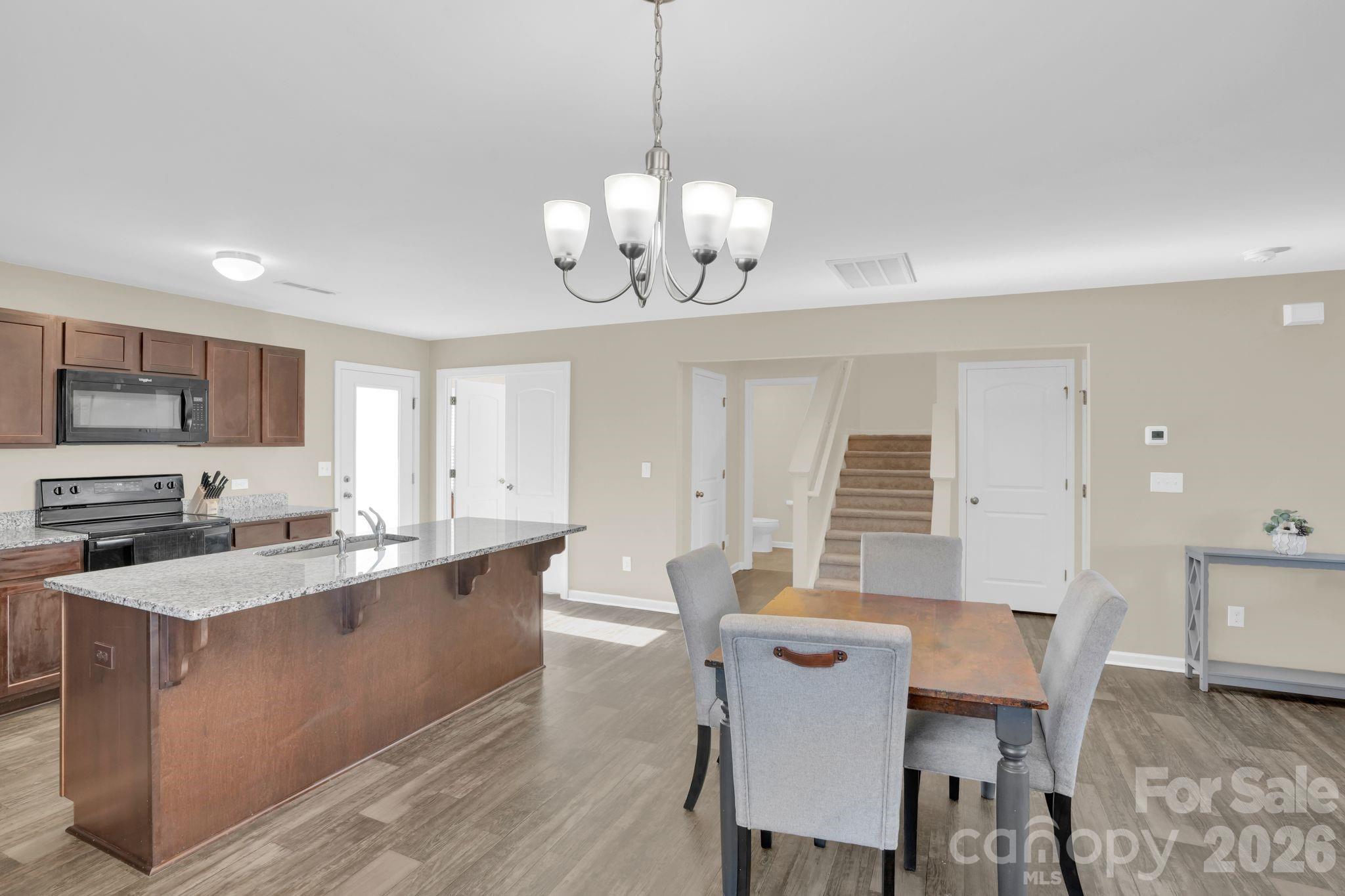 767 Gants Road York, SC 29745 - Photo 16 of 47 a large kitchen with a table and chairs