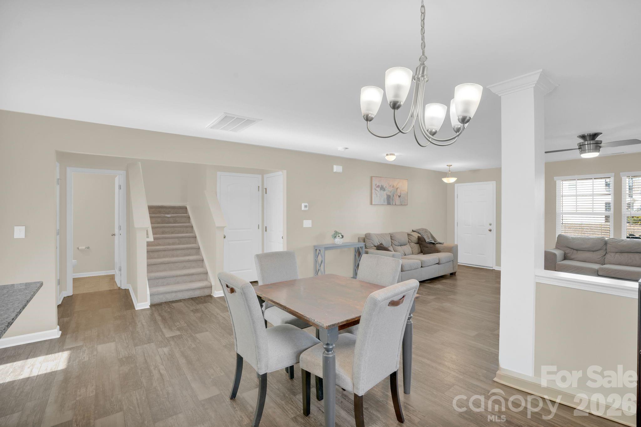 767 Gants Road York, SC 29745 - Photo 17 of 47 a view of a dining room with furniture wooden floor and chandelier