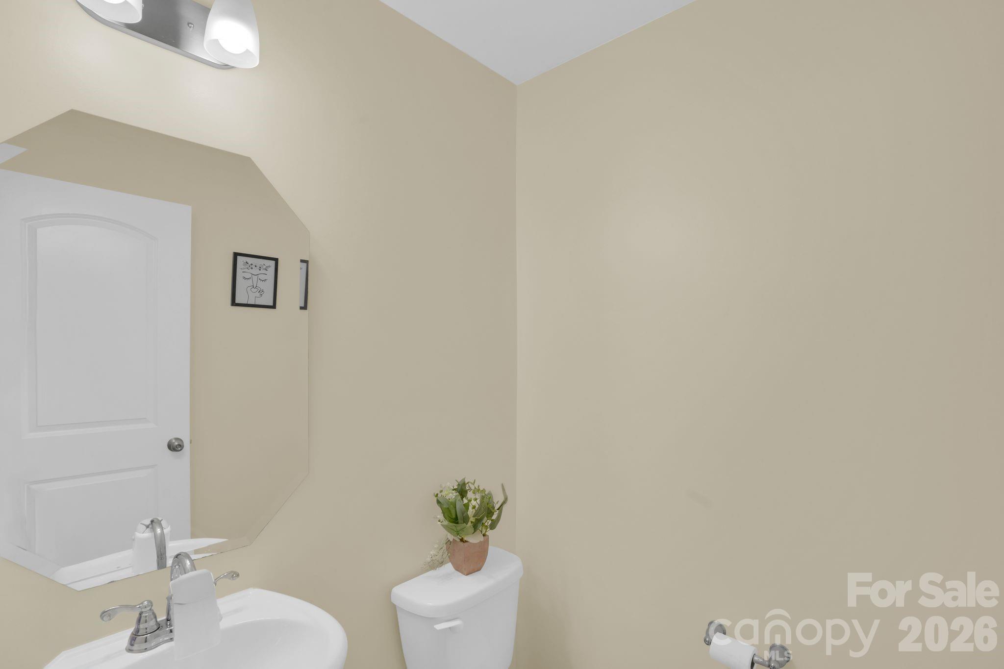 767 Gants Road York, SC 29745 - Photo 18 of 47 a white toilet sitting next to a bathroom sink