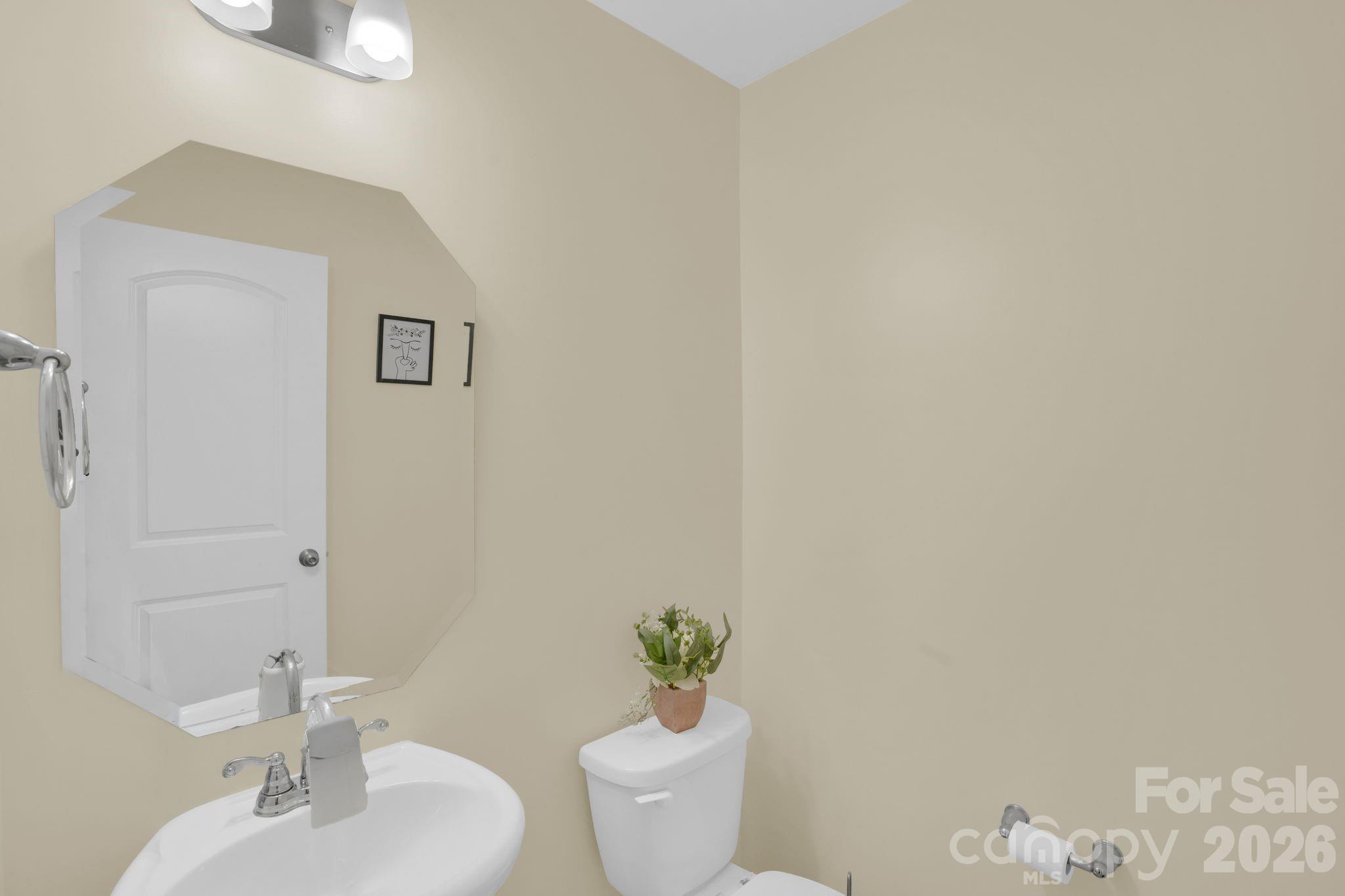 767 Gants Road York, SC 29745 - Photo 19 of 47 a bathroom with a sink a toilet and a mirror