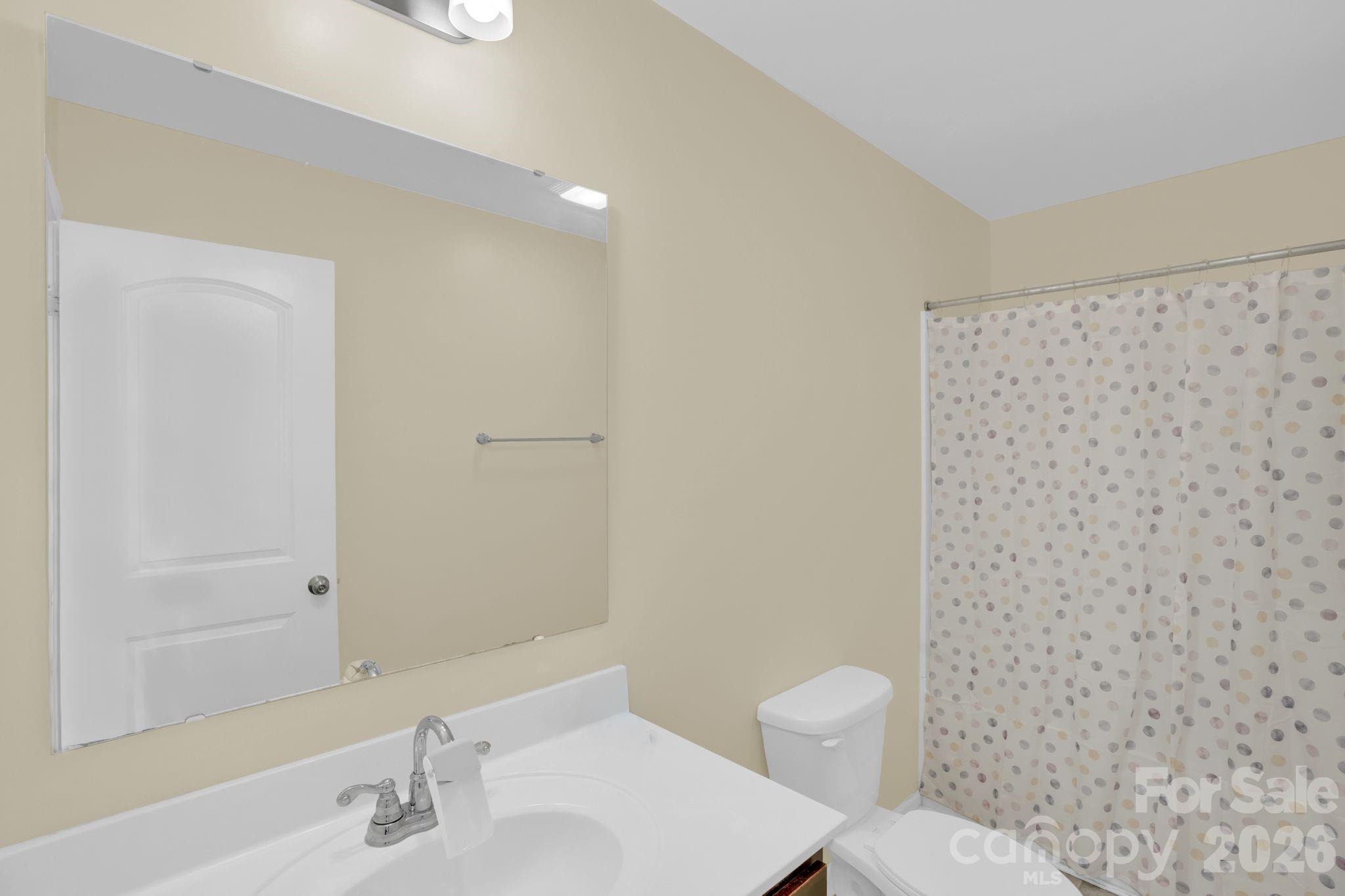 767 Gants Road York, SC 29745 - Photo 37 of 47 a bathroom with a toilet a sink and a mirror