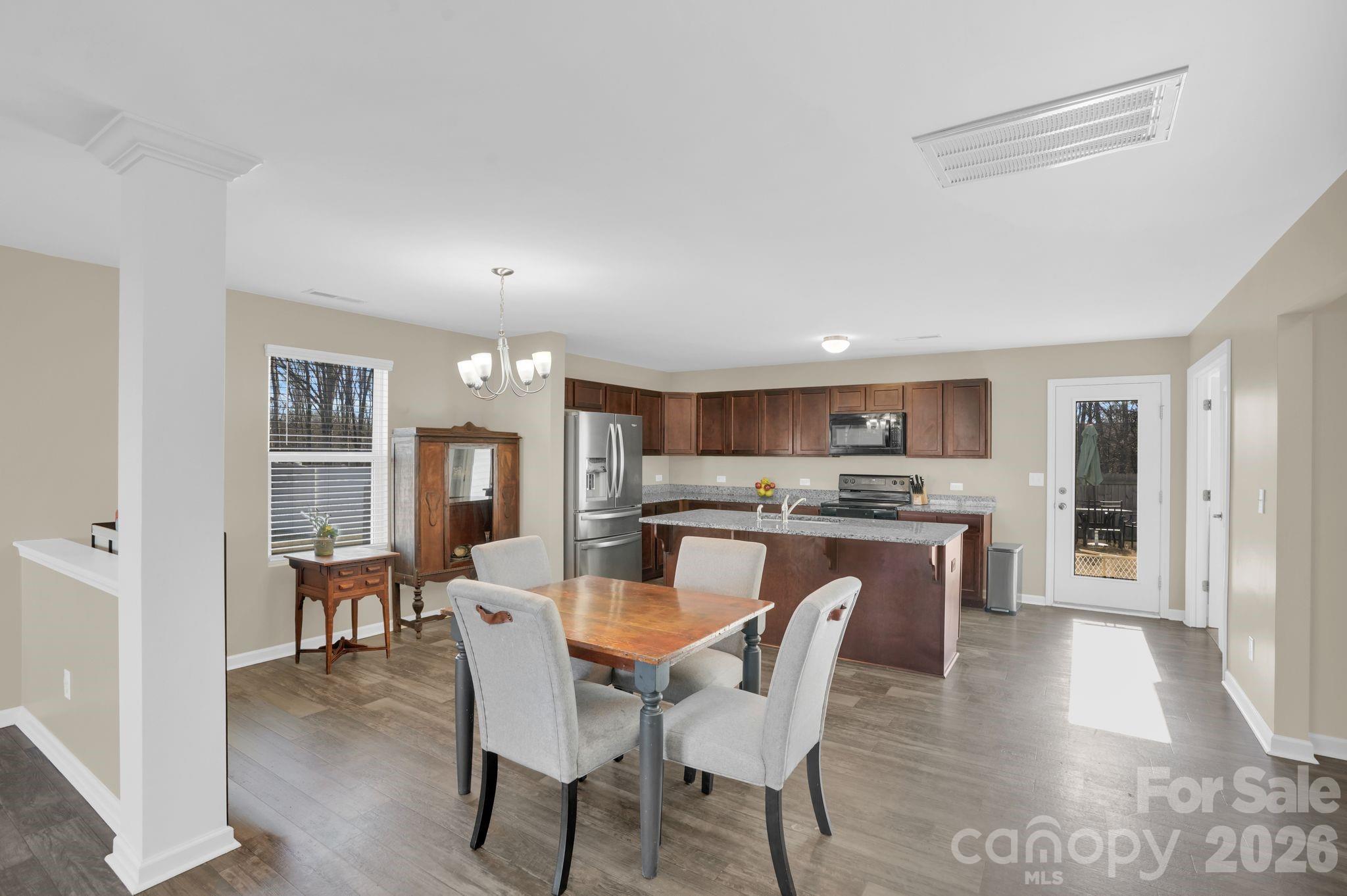 767 Gants Road York, SC 29745 - Photo 7 of 47 a view of a dining room with furniture wooden floor and a rug