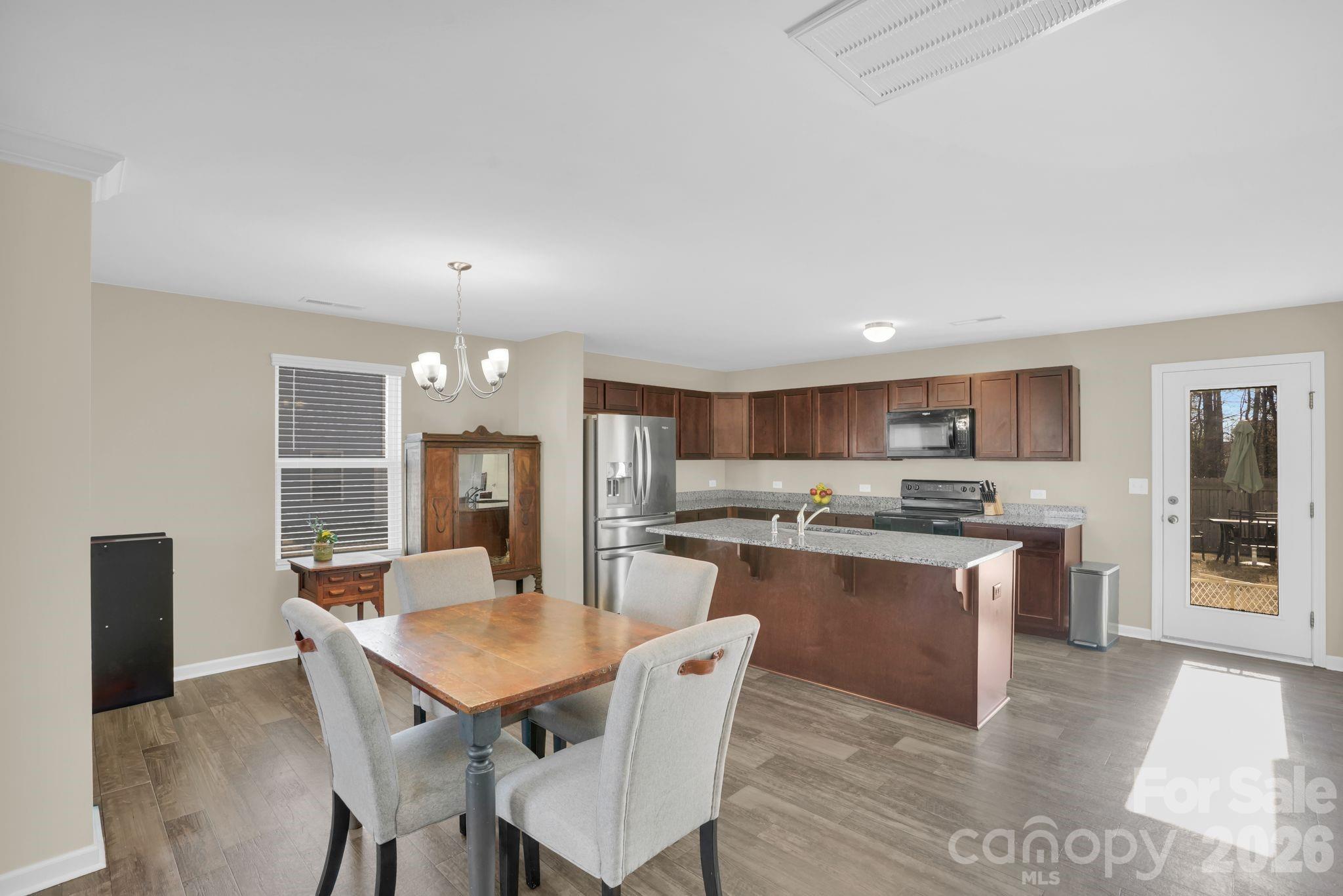 767 Gants Road York, SC 29745 - Photo 8 of 47 a kitchen with a table and chairs in it
