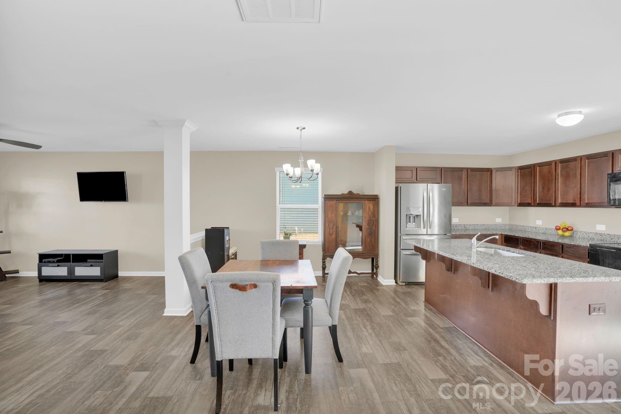 767 Gants Road York, SC 29745 - Photo 9 of 47 a view of a dining room with furniture and wooden floor