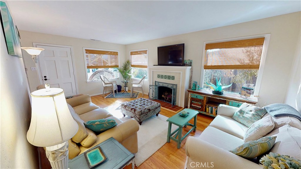 514 Middlefield Drive Aptos, CA 95003 - Photo 13 of 31 a living room with furniture a flat screen tv and a fireplace