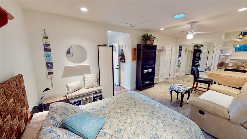 514 Middlefield Drive Aptos, CA 95003 - Photo 20 of 31 a bedroom with furniture and a wooden floor