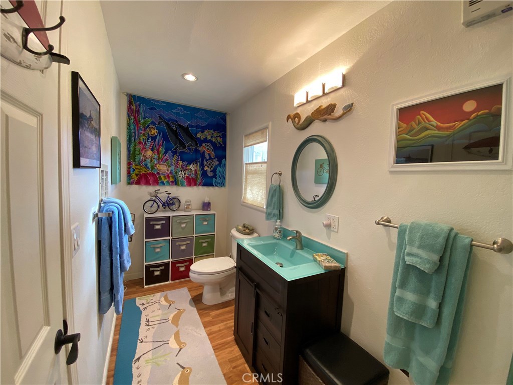 514 Middlefield Drive Aptos, CA 95003 - Photo 28 of 31 a living room with furniture a mirror and a fan