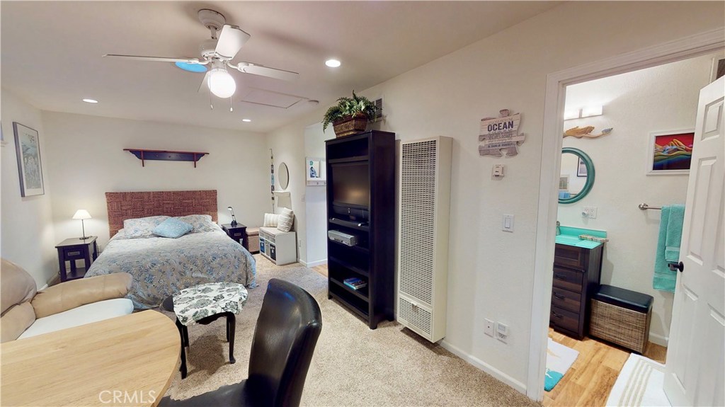 514 Middlefield Drive Aptos, CA 95003 - Photo 29 of 31 a bedroom with a bed and a chandelier