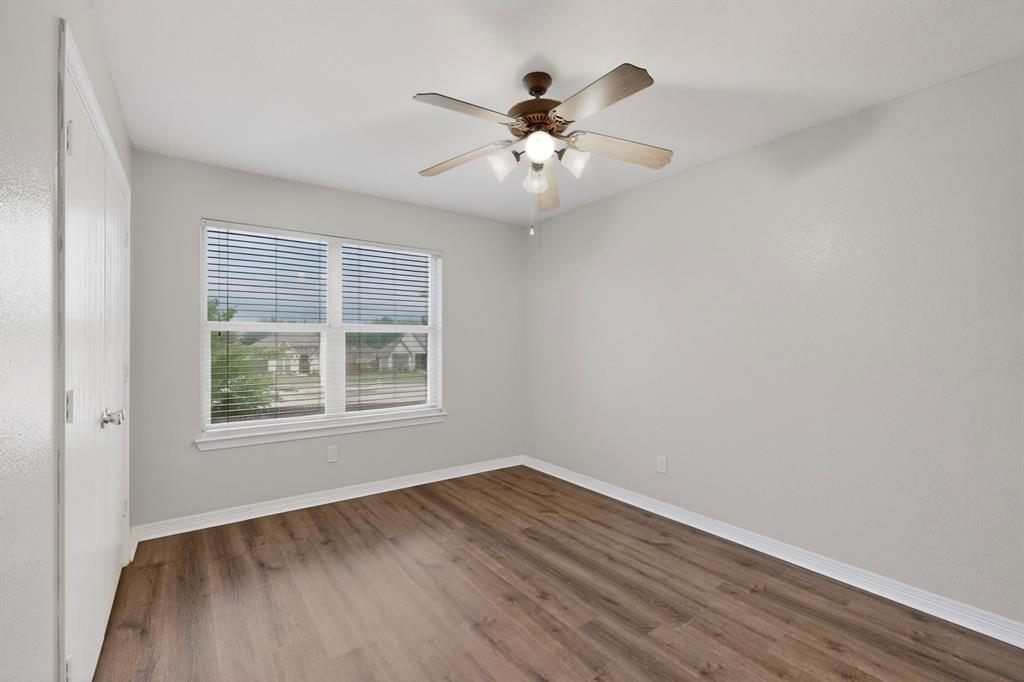 3401 Newgate Street Midlothian, TX 76065 - Photo 26 of 34 Room featuring wood-finish flooring, a ceiling fan with integrated lighting, and a window with horizontal blinds