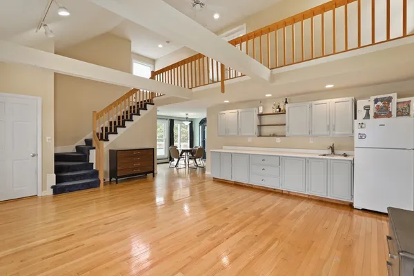 a view of kitchen with furniture and wooden floor