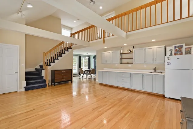 a view of kitchen with furniture and wooden floor
