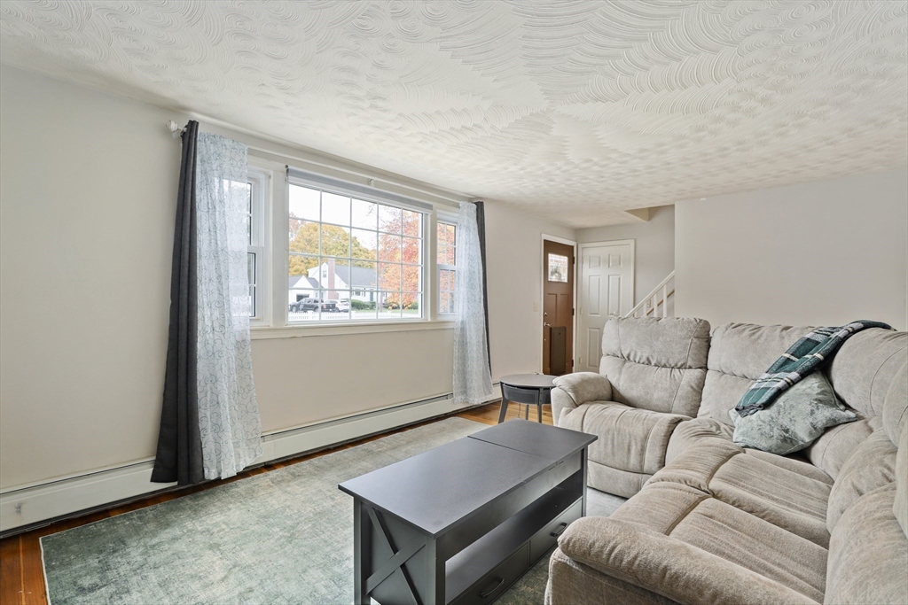 27 Pollard Drive Millis, MA 02054 - Photo 13 of 41 a living room with furniture and a window