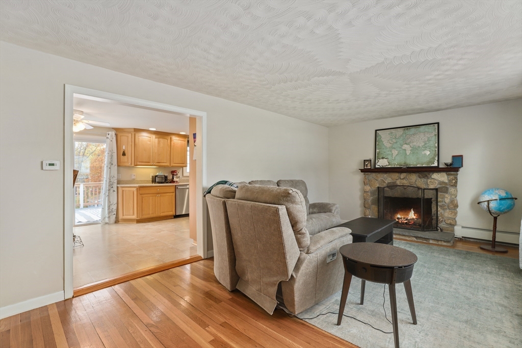 27 Pollard Drive Millis, MA 02054 - Photo 15 of 41 a living room with furniture and a fireplace