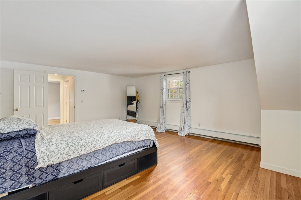 27 Pollard Drive Millis, MA 02054 - Photo 19 of 41 a living room with granite countertop furniture and a wooden floor