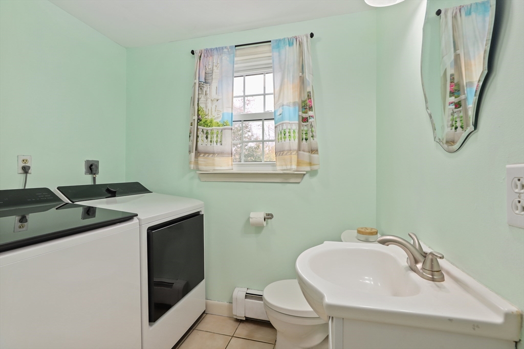 27 Pollard Drive Millis, MA 02054 - Photo 26 of 41 a bathroom with a sink and a toilet