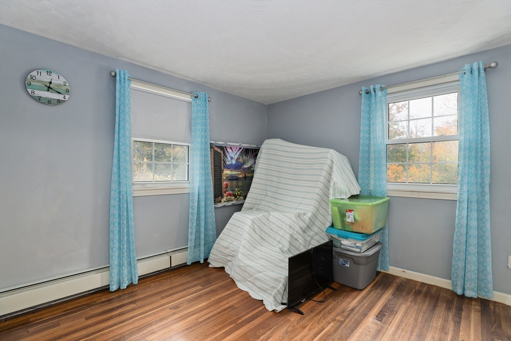 27 Pollard Drive Millis, MA 02054 - Photo 27 of 41 a living room with furniture and a window