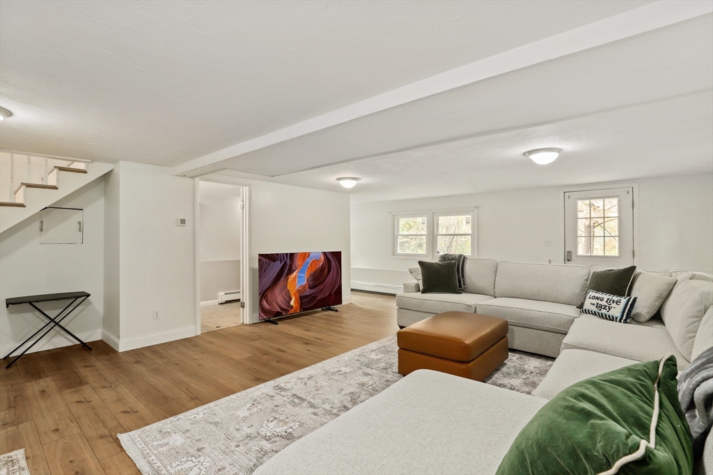 27 Pollard Drive Millis, MA 02054 - Photo 29 of 41 a bedroom with furniture and wooden floor