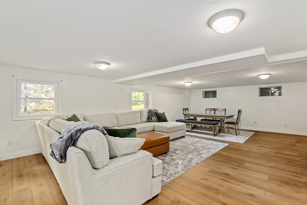 27 Pollard Drive Millis, MA 02054 - Photo 31 of 41 a living room with furniture and wooden floor