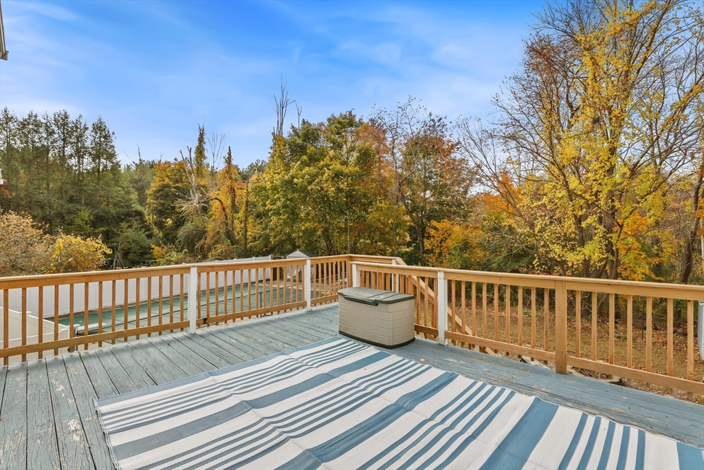 27 Pollard Drive Millis, MA 02054 - Photo 34 of 41 a view of a roof deck with wooden floor and fence