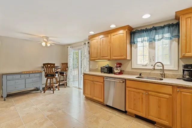 a kitchen with sink cabinets and window