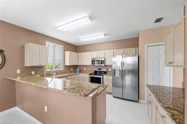 a kitchen with refrigerator and countertop