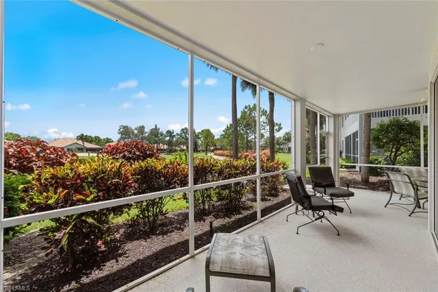 a view of a balcony with chairs