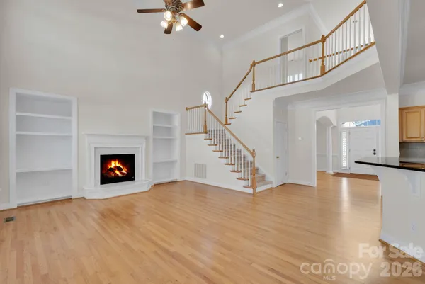 a view of an empty room and wooden floor