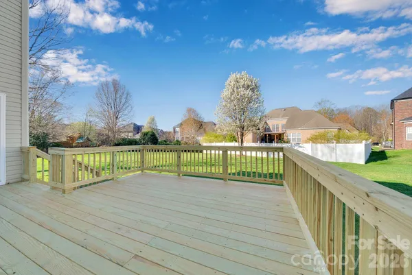 a view of a balcony with wooden floor
