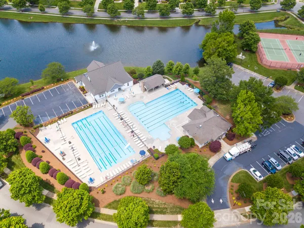a view of a lake with a table and chairs