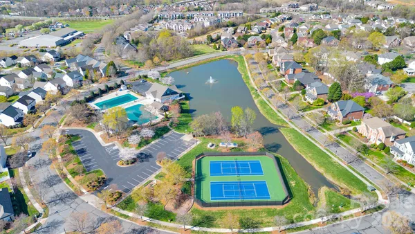 a view of house with yard outdoor seating and barbeque oven