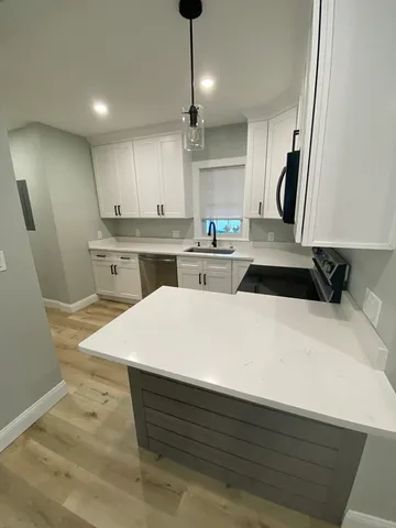 a kitchen with a sink a stove and refrigerator
