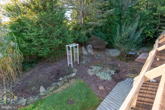 a backyard view with a seating space