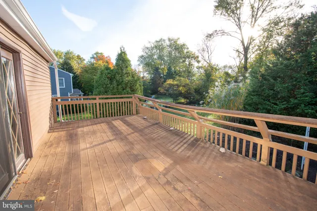 a view of balcony with deck and trees