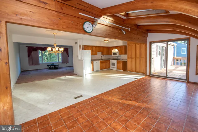 a view of a hallway with a kitchen
