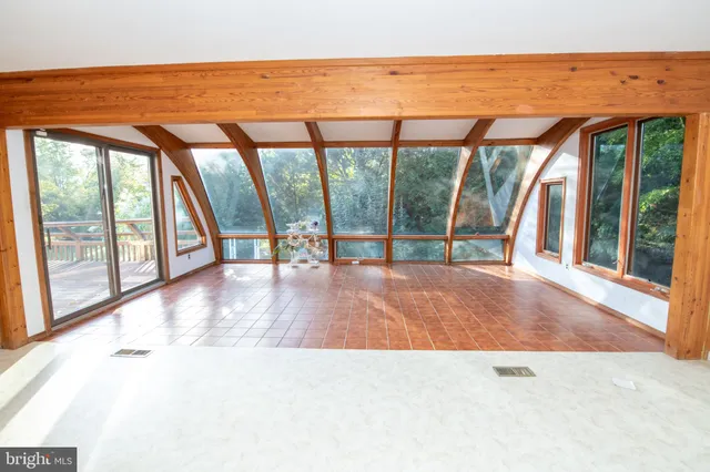 a view of a livingroom with furniture window and outside view