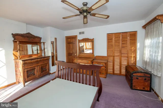 a view of a hallway with windows