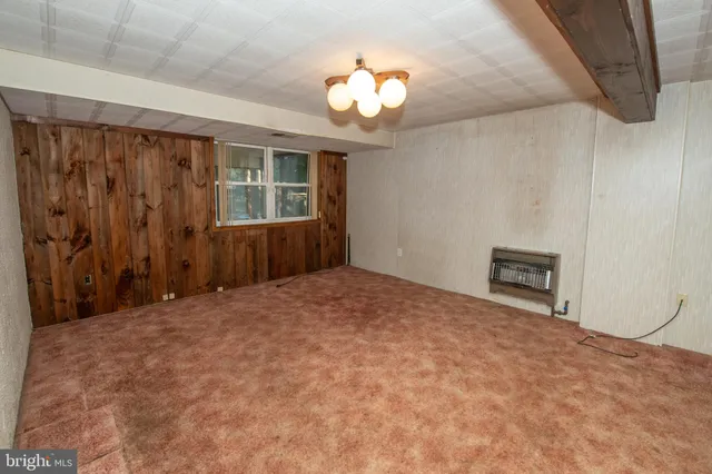 a bathroom with a granite countertop sink and a vanity