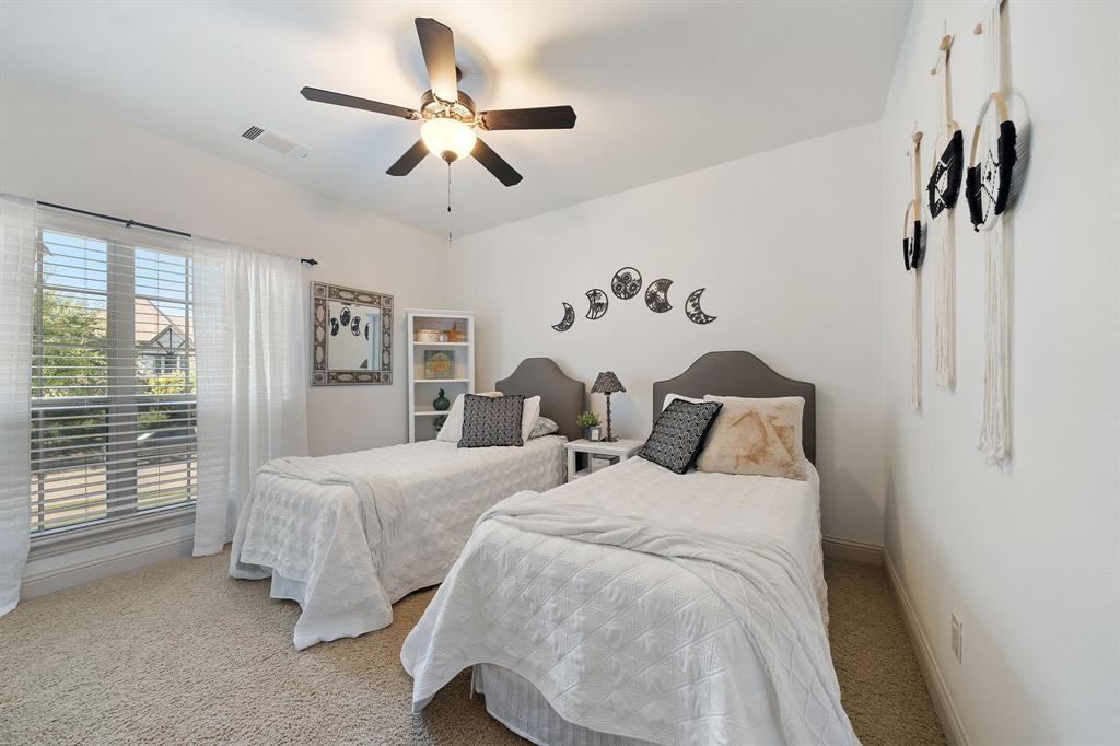 3108 Jenbri Street Flower Mound, TX 75022 - Photo 25 of 39 Two bedrooms upstairs. Walk in closets provide ample storage.