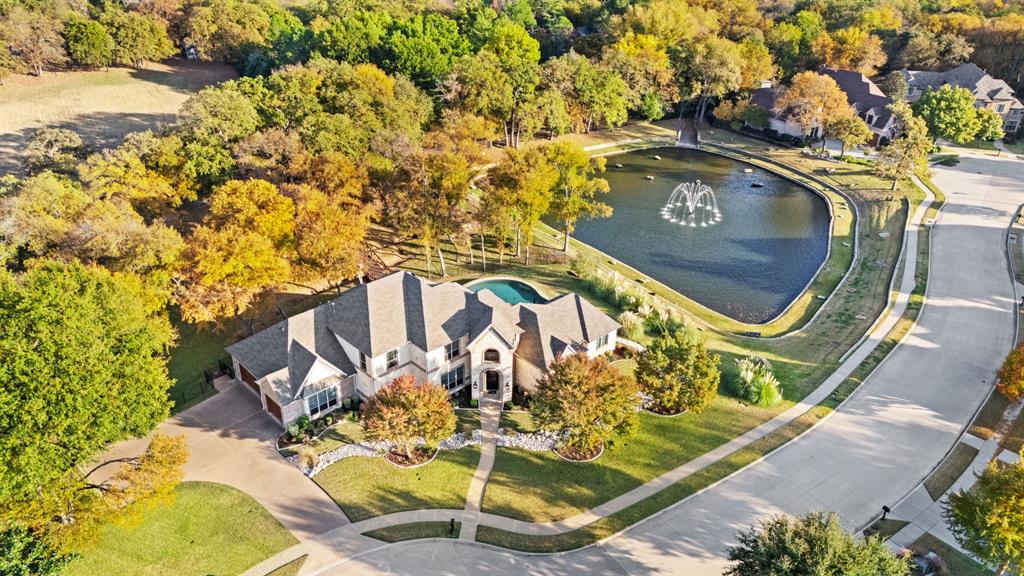 3108 Jenbri Street Flower Mound, TX 75022 - Photo 36 of 39 Unique, centrally located, 1.46 Acre sprawling Flower Mound property features fenced wooded backyard, 70' footbridge, pool and spa, adjacent community pond with fountain.