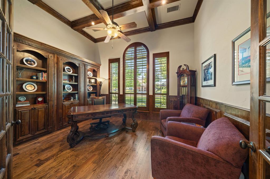 3108 Jenbri Street Flower Mound, TX 75022 - Photo 8 of 39 The well appointed executive's home office features a wall of custom cabinets, beamed ceiling, hardwood floors, wainscoting, shutters and a closet for further storage.
