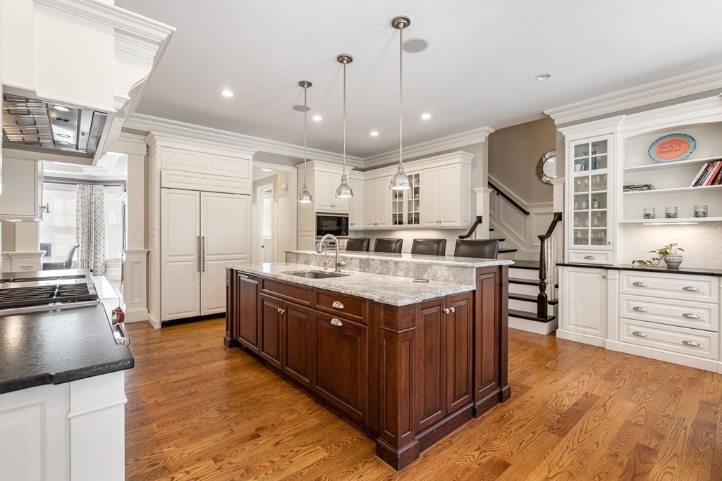55 Edmunds Road Wellesley, MA 02481 - Photo 13 of 40 a kitchen with stainless steel appliances granite countertop a sink stove and refrigerator