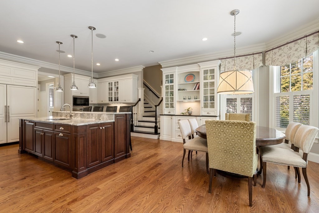 55 Edmunds Road Wellesley, MA 02481 - Photo 14 of 40 a kitchen with stainless steel appliances granite countertop a stove and a wooden floors