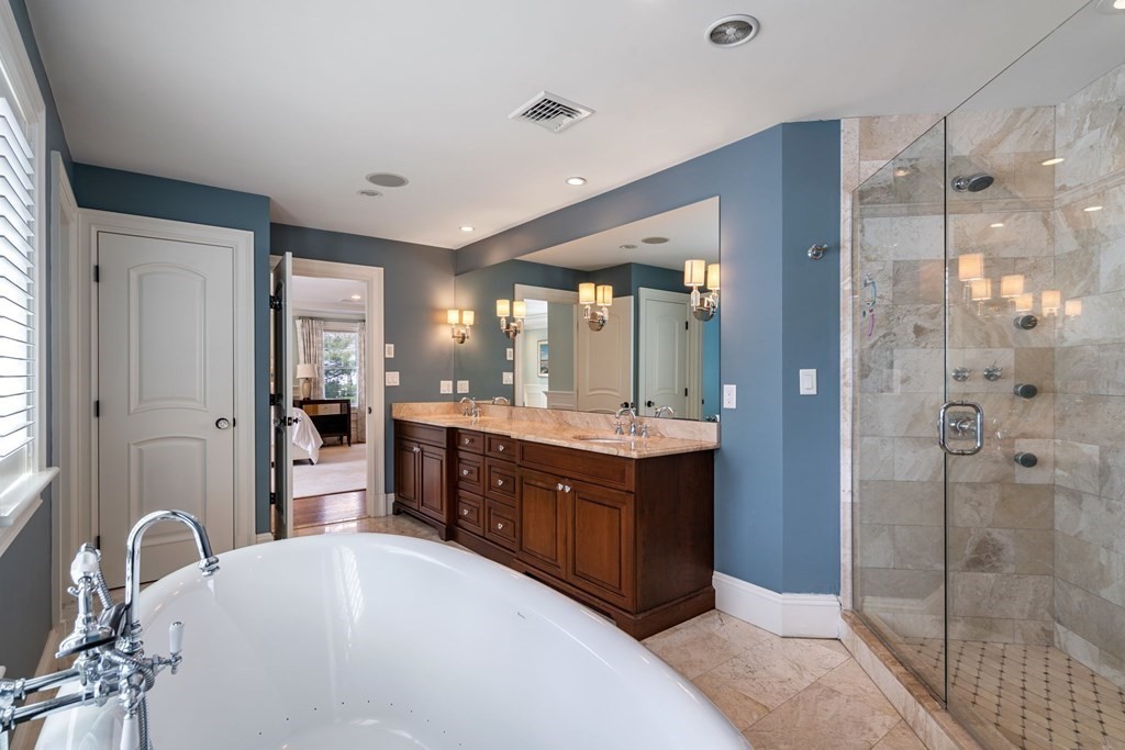 55 Edmunds Road Wellesley, MA 02481 - Photo 26 of 40 a bathroom with a sink and a mirror