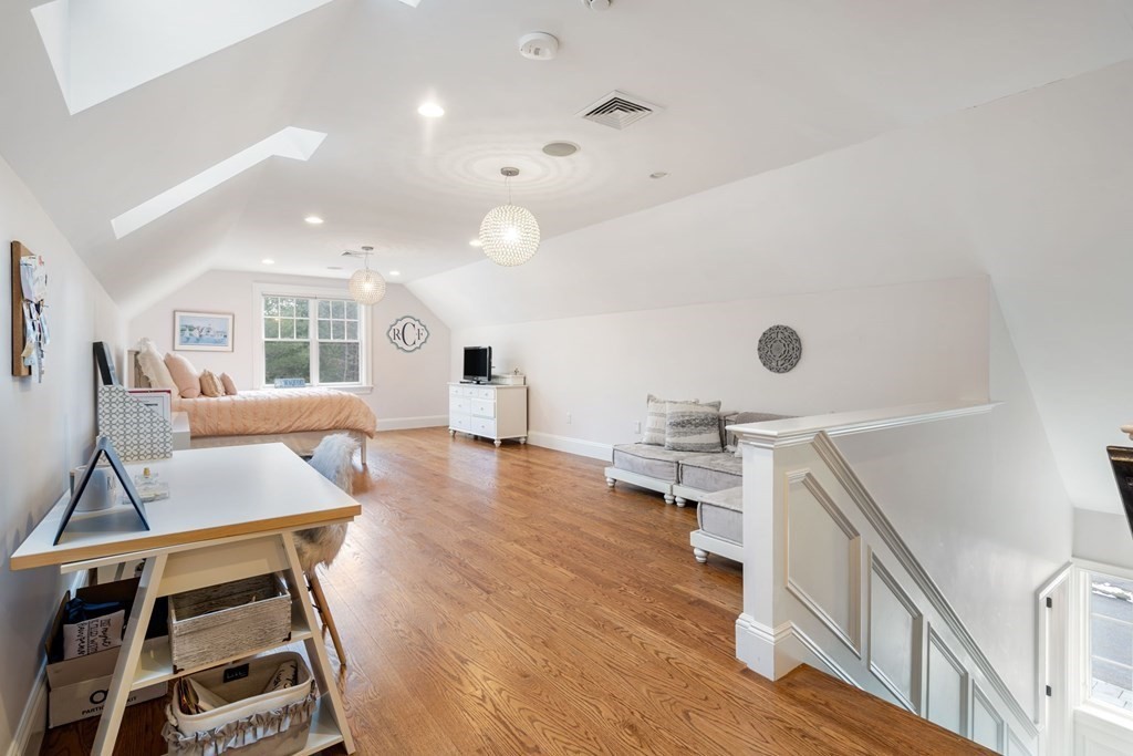 55 Edmunds Road Wellesley, MA 02481 - Photo 29 of 40 a living room with dining room and wooden floor