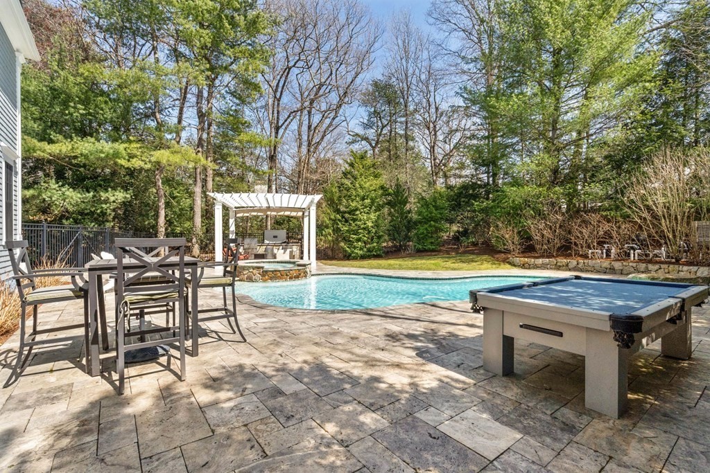 55 Edmunds Road Wellesley, MA 02481 - Photo 37 of 40 a view of a chairs and table on the patio