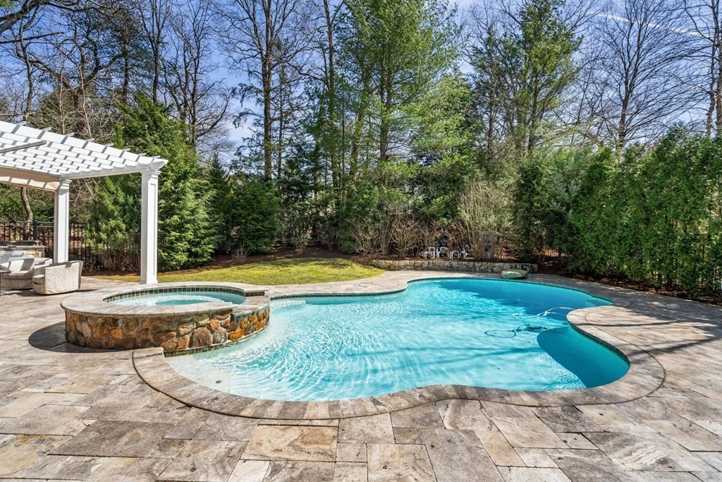55 Edmunds Road Wellesley, MA 02481 - Photo 38 of 40 a view of a swimming pool with a patio