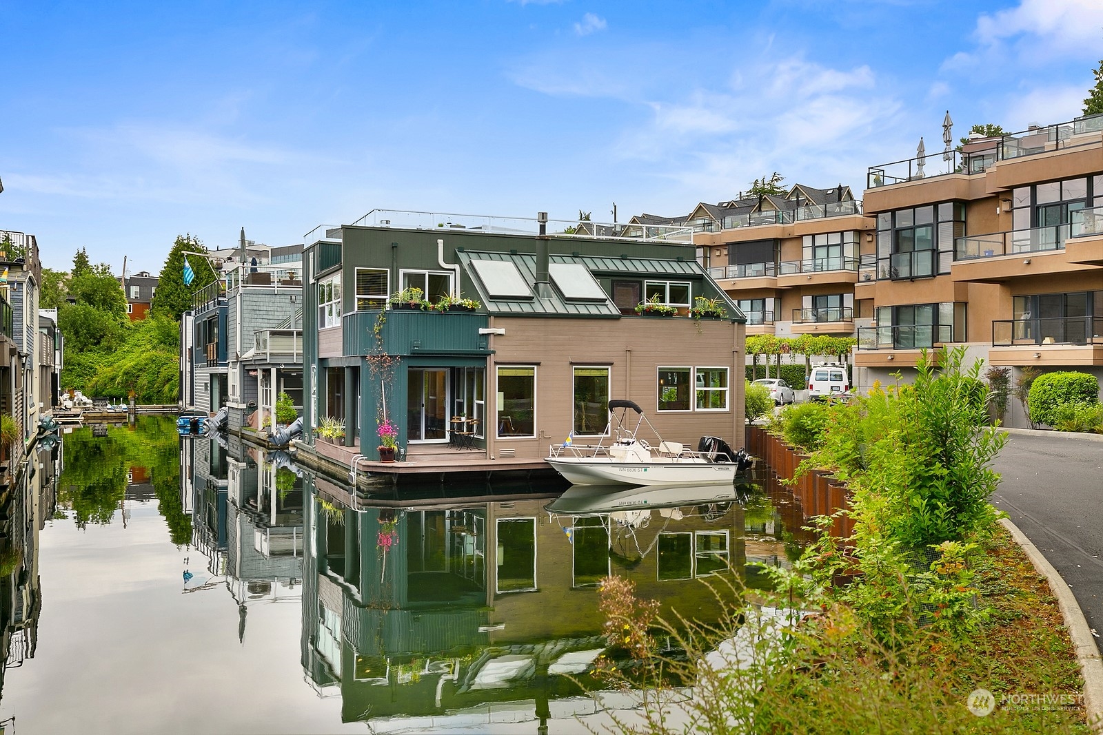 a front view of a residential apartment building with a yard