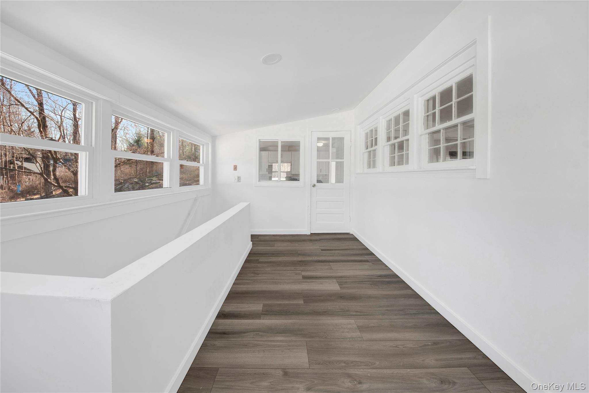 690 Gipsy Trail Road Carmel, NY 10512 - Photo 19 of 35 a view of a big room with wooden floor and windows