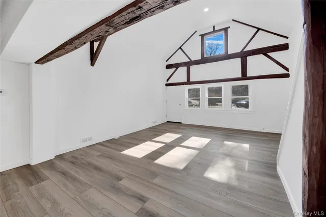 a view of a house with wooden deck